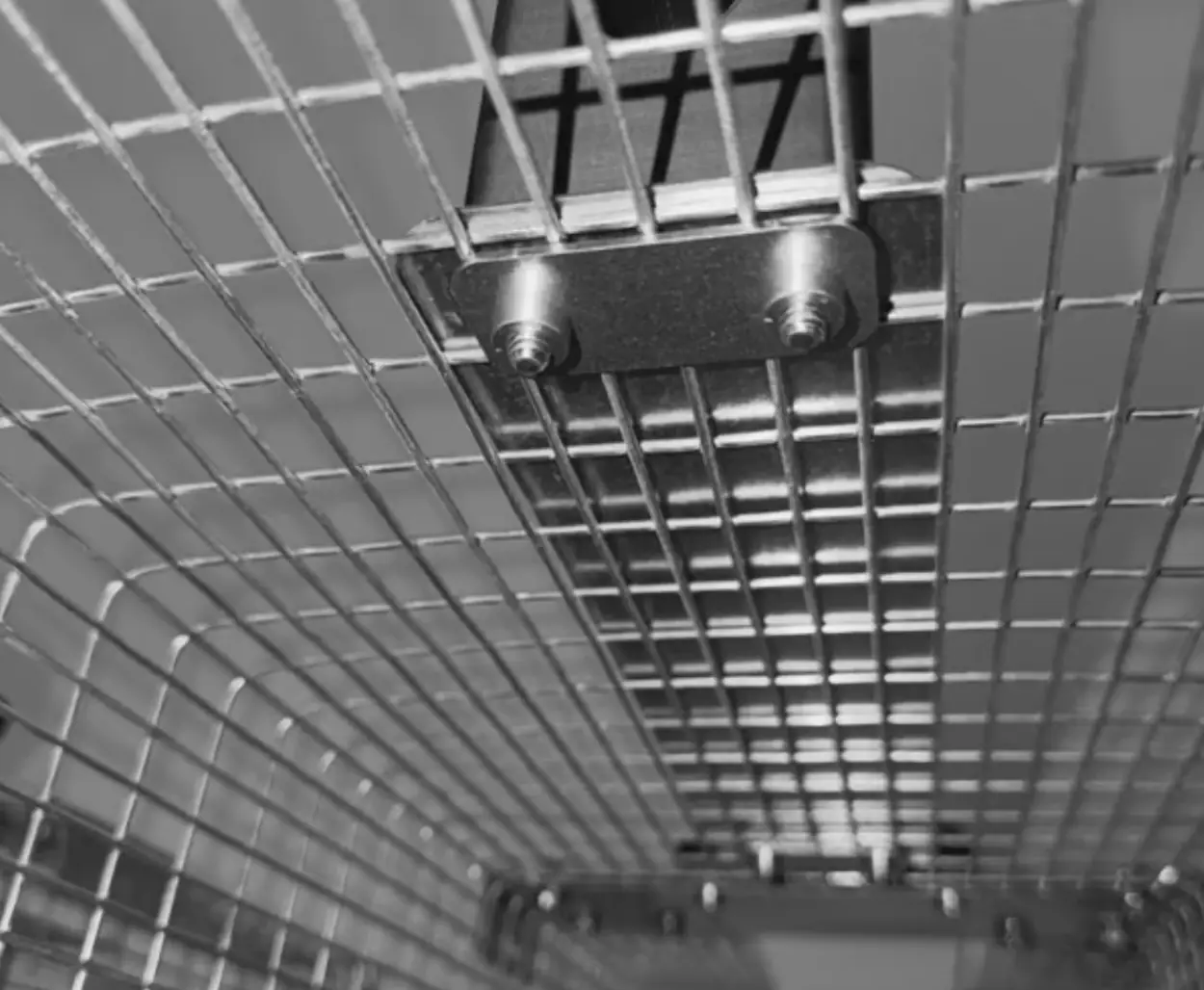 Inside the trap, looking up at the plate that holds the handle bolts
